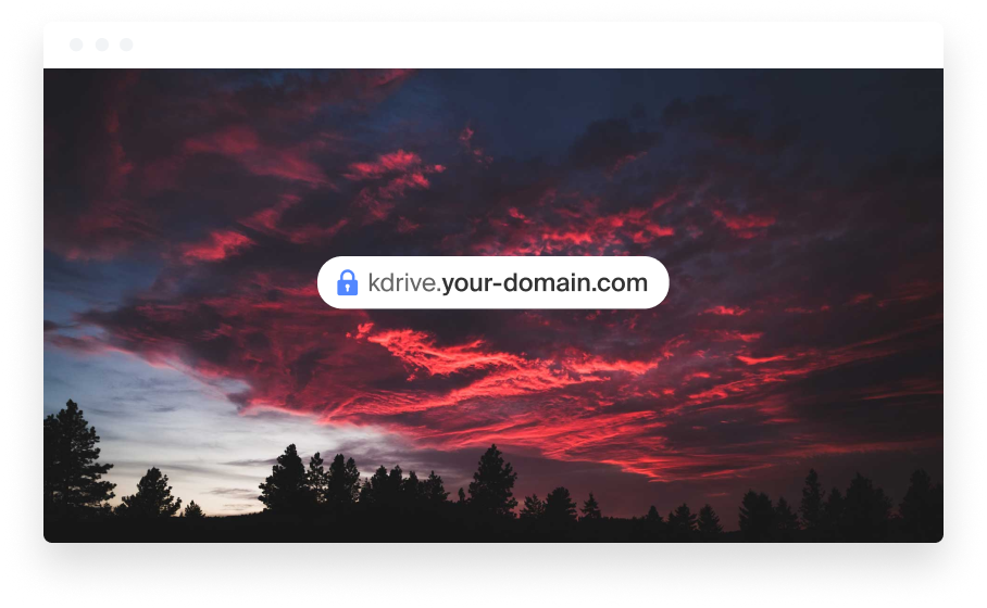 Laptop showing a customised kDrive domain in a browser against a sunset sky.